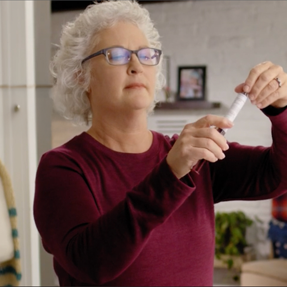 Melaine, a patient advocate preparing to self-infuse in her home